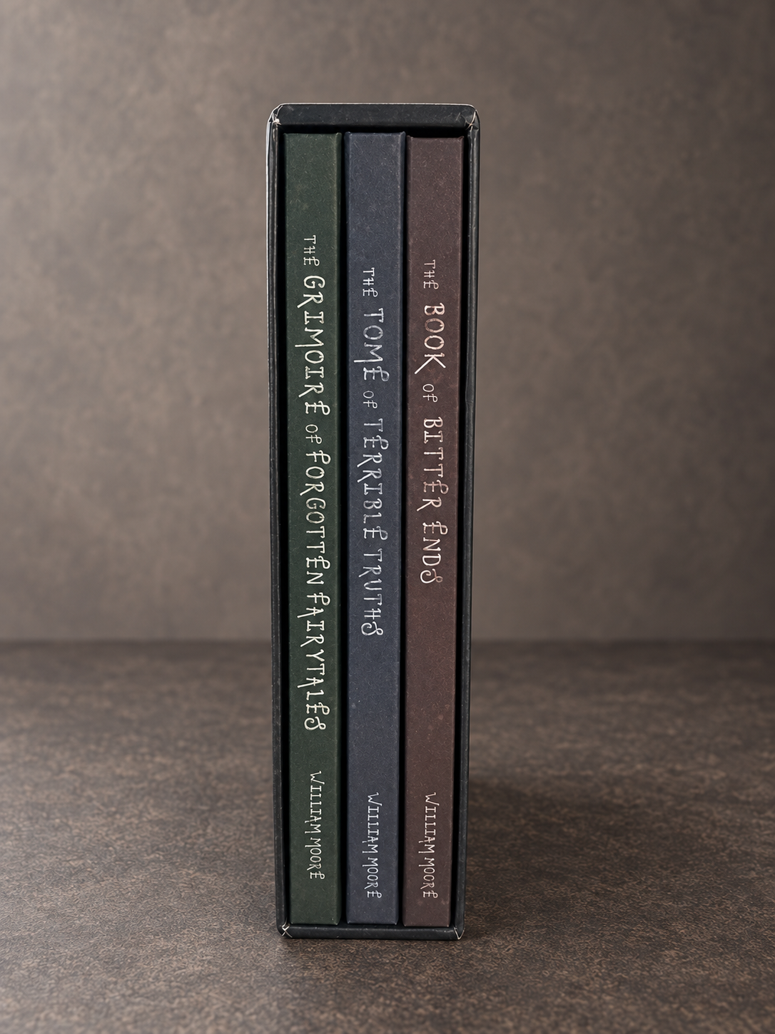 The spines of all three books inside the trilogy slipcase